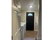Functional laundry room featuring modern appliances and an exterior door at 8502 Simpson Rd, Waxhaw, NC 28173