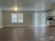 Bright living room with hardwood floors and a large window, offering ample natural light at 8502 Simpson Rd, Waxhaw, NC 28173