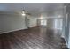 Spacious living room with modern flooring, ceiling fan and natural light at 8502 Simpson Rd, Waxhaw, NC 28173