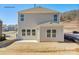 Spacious backyard with patio and view of the rear of the two-story home at 882 Two Brothers Ln, York, SC 29745