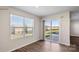 Bedroom with sliding glass doors to backyard, large window and hardwood floors at 882 Two Brothers Ln, York, SC 29745
