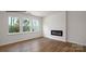 Bright living room featuring a fireplace, hardwood floors and large windows at 882 Two Brothers Ln, York, SC 29745