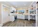 Modern kitchen features white cabinets, stainless steel appliances, and an eat-in bar at 1132 E Main St, Albemarle, NC 28001