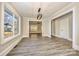Bright living room with large windows showcasing the home's interior design and flooring at 1132 E Main St, Albemarle, NC 28001