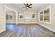 Bright living room featuring a coffered ceiling, a stone fireplace, and large windows at 1132 E Main St, Albemarle, NC 28001