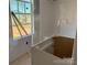 Bathroom featuring a window for natural light, awaiting your personal design at 1259 Willow Grove Ln # 100, York, SC 29745