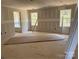 Spacious bedroom with two windows allowing for natural light and view of attached bathroom at 1259 Willow Grove Ln # 100, York, SC 29745
