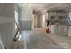 Open-concept kitchen and living area with freshly installed drywall, and modern cabinets are visible at 1259 Willow Grove Ln # 100, York, SC 29745