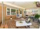 Inviting covered porch with a relaxing hammock, grill, and cozy seating area at 1747 Williams Cir, Lancaster, SC 29720