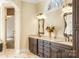 Elegant bathroom featuring double vanities, granite counters, and a glass-enclosed shower at 2017 Colorado Ct, Lancaster, SC 29720