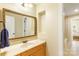 Bathroom with double vanity, framed mirror, and doorway leading to adjacent bedroom at 2017 Colorado Ct, Lancaster, SC 29720