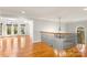 A naturally lit foyer area features hardwood floors, chandelier lighting, staircase with iron railing at 2017 Colorado Ct, Lancaster, SC 29720