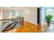 A beautiful foyer area featuring hardwood floors, chandelier lighting, staircase, and natural light at 2017 Colorado Ct, Lancaster, SC 29720