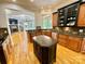 A stunning kitchen featuring dark wood cabinets, stainless steel appliances and granite countertops at 2017 Colorado Ct, Lancaster, SC 29720
