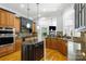 Well-equipped kitchen with island, granite counters, stainless appliances, open to living areas at 2017 Colorado Ct, Lancaster, SC 29720