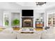 Cozy living room featuring a fireplace, large windows, and comfortable seating at 2017 Colorado Ct, Lancaster, SC 29720