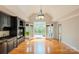 Spacious living room with hardwood floors, custom built-ins, and french doors leading to the exterior at 2017 Colorado Ct, Lancaster, SC 29720