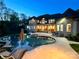 Stunning backyard with a luxurious pool, spa, and ample lounge space, perfect for relaxation and entertaining at 2017 Colorado Ct, Lancaster, SC 29720