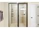 Elegant tiled shower features dual glass doors, a rainfall shower head, and a built-in shelving unit at 2017 Colorado Ct, Lancaster, SC 29720
