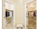 This home includes two walk-in closets featuring tile flooring, hanging racks, and custom lighting at 2017 Colorado Ct, Lancaster, SC 29720