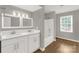 Spacious bathroom with dual sinks, large mirror, and shower/tub combo at 2220 Ross Cauthen Rd, Lancaster, SC 29720