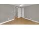 Cozy bedroom with neutral walls, wood-look flooring, and white doors at 2220 Ross Cauthen Rd, Lancaster, SC 29720
