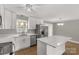 Modern kitchen with stainless steel appliances, white cabinets, and island at 2220 Ross Cauthen Rd, Lancaster, SC 29720