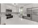 Updated kitchen with stainless steel appliances, white cabinetry, and stone countertops at 2220 Ross Cauthen Rd, Lancaster, SC 29720