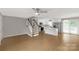 Bright and open living space features a staircase, kitchen, and wood-look flooring throughout at 2220 Ross Cauthen Rd, Lancaster, SC 29720