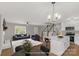 Living room showcases natural light, fireplace, and adjacent kitchen area with updated fixtures and finishes at 2220 Ross Cauthen Rd, Lancaster, SC 29720