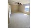 Comfortable bedroom with soft carpet, natural light, and a neutral color palette at 353 Montibello Dr, Mooresville, NC 28117