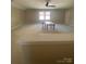 Spacious bonus room with neutral carpet and a ceiling fan at 353 Montibello Dr, Mooresville, NC 28117