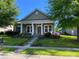 Craftsman style home featuring a covered porch, beautiful front yard landscaping, and inviting curb appeal at 353 Montibello Dr, Mooresville, NC 28117