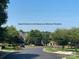 A gated entrance with landscaping and clear blue skies at 353 Montibello Dr, Mooresville, NC 28117