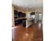 Gourmet kitchen boasts stainless appliances, a large island, and dark wood cabinets at 353 Montibello Dr, Mooresville, NC 28117