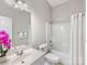 Well-lit bathroom featuring a single vanity sink and a shower-tub combo with white shower curtain at 4148 Cedar Point Ave, Matthews, NC 28104