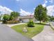 A single-Gathering home with well-kept lawn, driveway, and attached two-car garage at 4148 Cedar Point Ave, Matthews, NC 28104