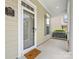 Covered front porch showcasing the home's address plaque, a 'Welcome' mat, and view of the neighborhood at 4148 Cedar Point Ave, Matthews, NC 28104