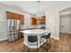 Updated kitchen featuring stainless steel appliances, ample counter space and an island at 4148 Cedar Point Ave, Matthews, NC 28104