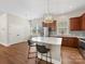 Kitchen with a center island, stainless steel appliances and two bar stools at 4148 Cedar Point Ave, Matthews, NC 28104
