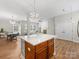 Open concept view of the kitchen, dining room and living room spaces at 4148 Cedar Point Ave, Matthews, NC 28104