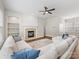 Inviting living room features a cozy fireplace, built-in shelving, and a comfortable, oversized sectional sofa at 4148 Cedar Point Ave, Matthews, NC 28104