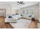 Spacious living room featuring a large sectional couch and natural light at 4148 Cedar Point Ave, Matthews, NC 28104