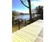 Backyard deck view showing lake access and waterfront tranquility at 141 Sunrise Pt, New London, NC 28127