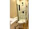 Elegant bathroom with marble-tiled shower, glass enclosure, modern fixtures, and vanity at 141 Sunrise Pt, New London, NC 28127