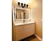 Bathroom vanity with decorative mirror and marble countertop at 141 Sunrise Pt, New London, NC 28127