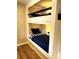 Custom built-in bunk beds with lighting and bedding at 141 Sunrise Pt, New London, NC 28127
