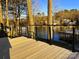 View of the lake from the deck with black metal cable railing at 141 Sunrise Pt, New London, NC 28127