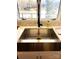 Close up of the Stainless farmhouse sink with faucet and exterior view at 141 Sunrise Pt, New London, NC 28127