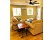 Cozy living room features two comfortable sofas, hardwood floors, and plenty of natural light at 141 Sunrise Pt, New London, NC 28127